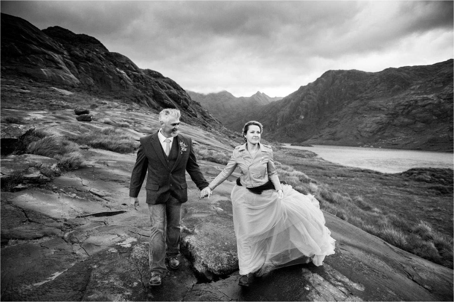 Black and white dramatic wedding photo of a bride and groom on the Isle of Skye. 
