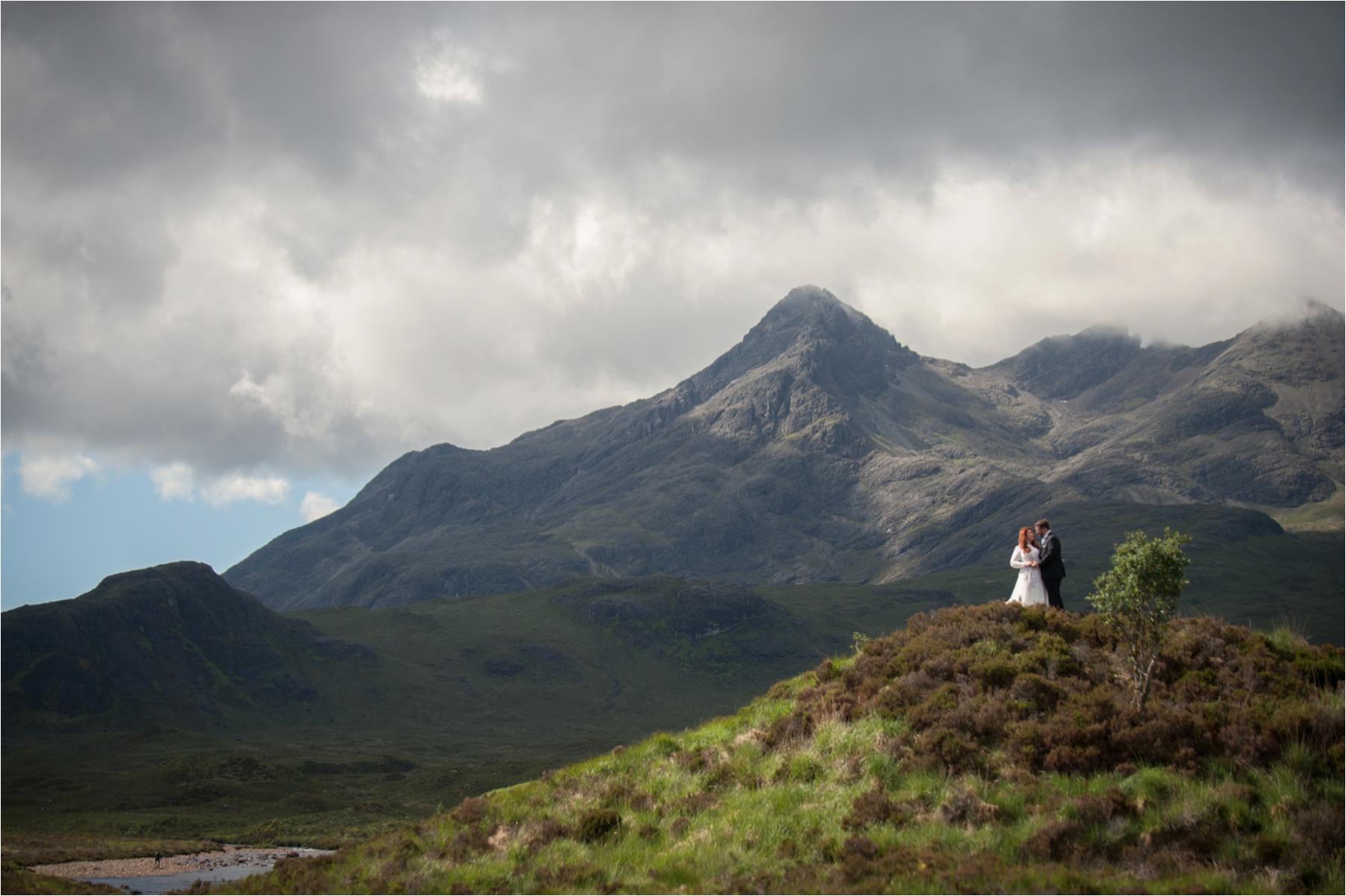Dramatic bride and groom portraits in the Scottish Highlands after an outdoor ceremony on the Isle of Skye. 