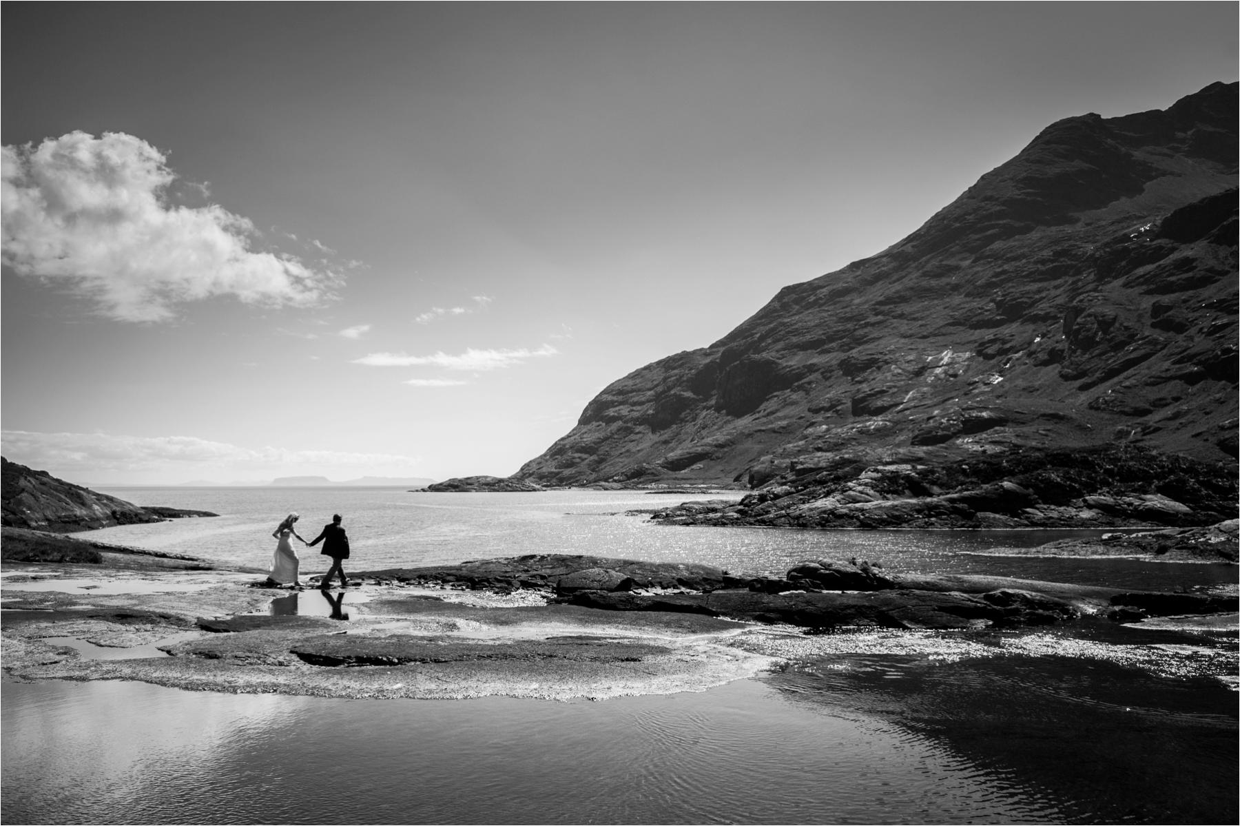 A black and white couple portrait on Loch Coruisk. 