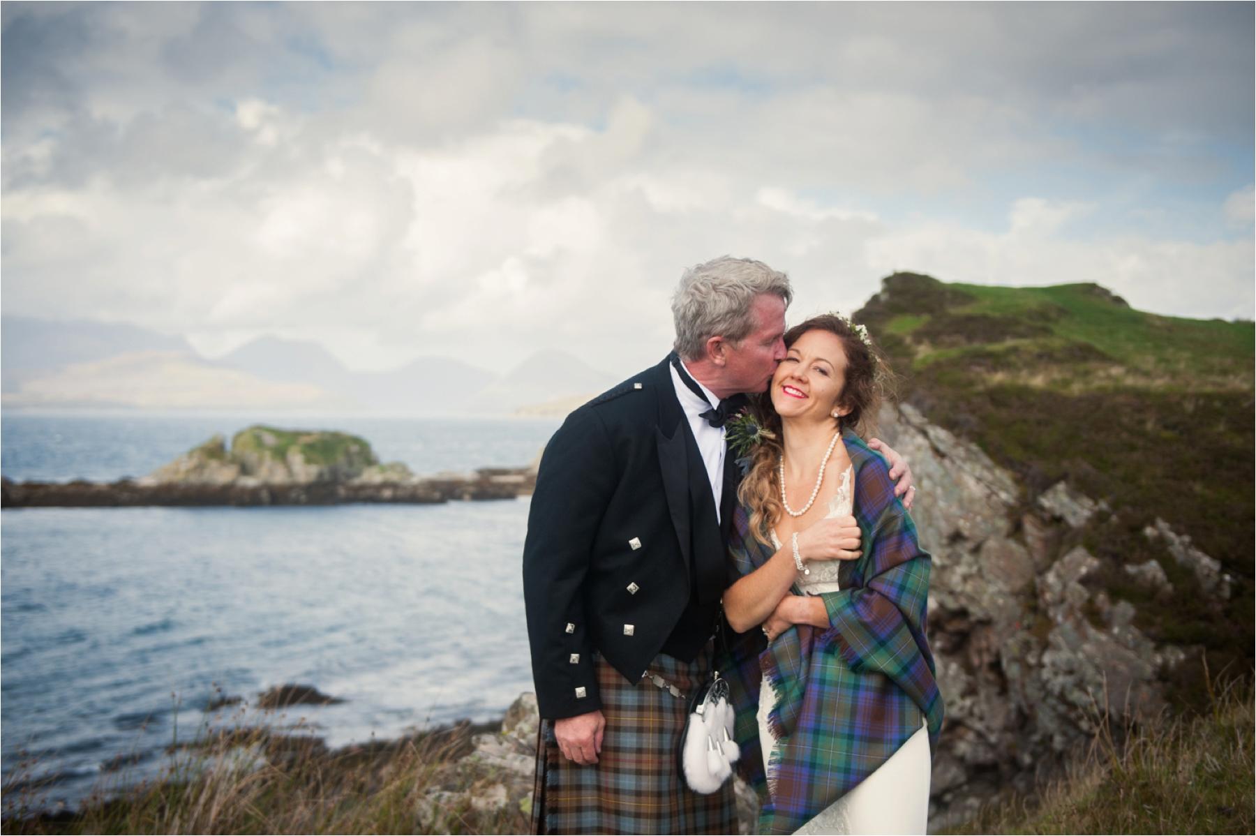 Bride and groom portraits near Dunscaith Castle on the Isle of Skye in the Scottish Highlands. 